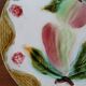 Assiette ancienne en barbotine