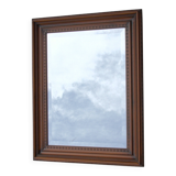 Vertical mirror, bevelled glass and carved wooden frame, 68x88cm