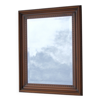 Vertical mirror, bevelled glass and carved wooden frame, 68x88cm