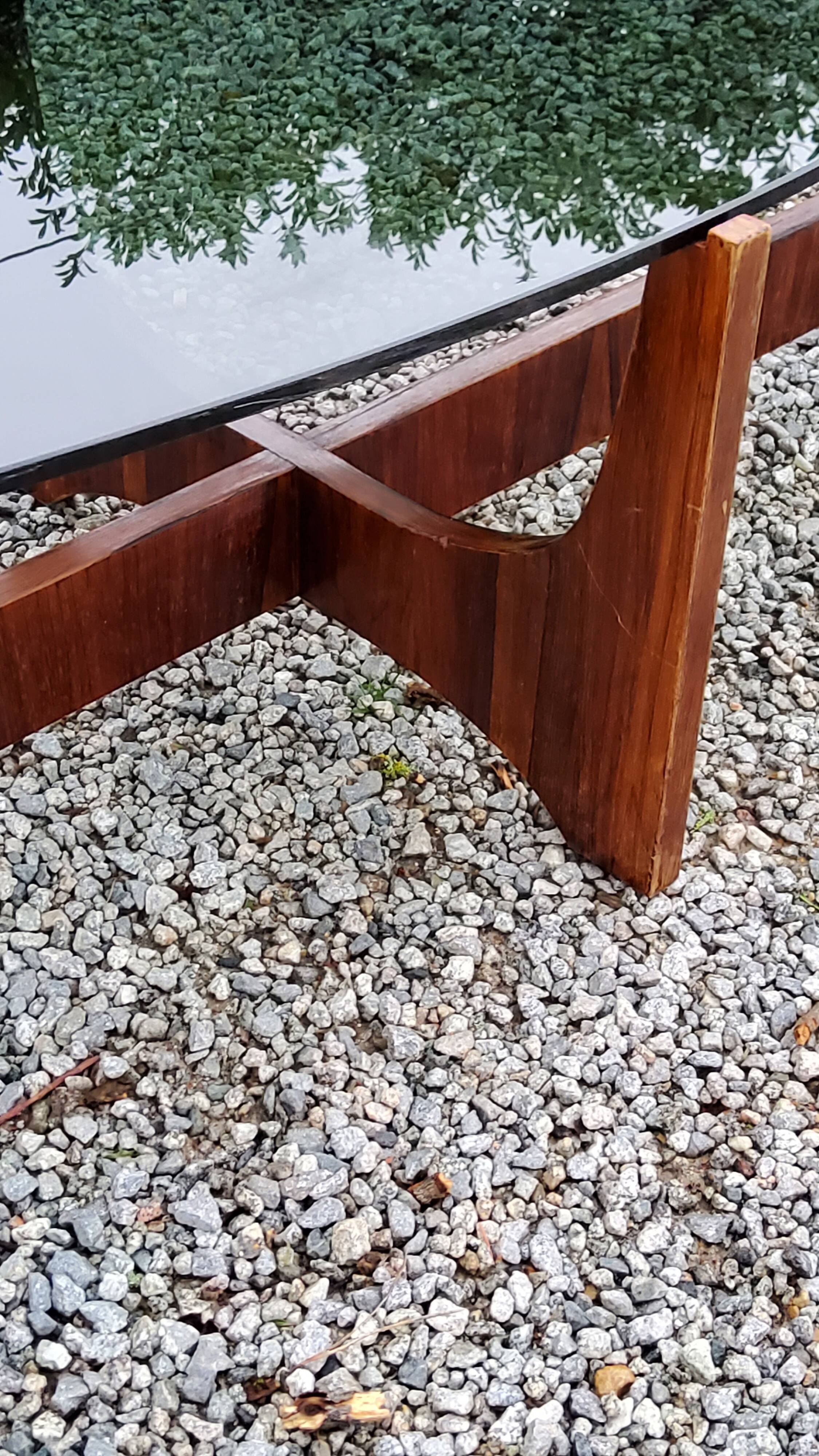 Designer coffee table by Hugues Poignant in rosewood and smoked glass from the 70s