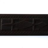 Carved African wall plate, door top