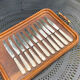 Set of 11 large silver metal knives