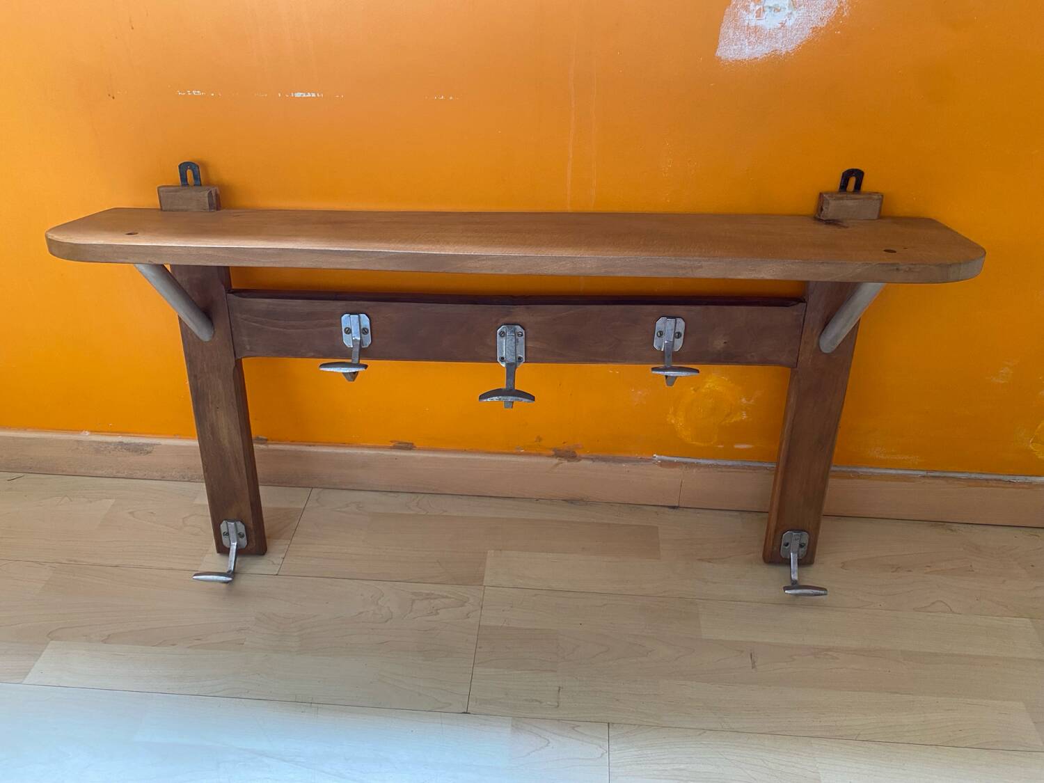 Wall-mounted coat rack with vintage hooks