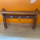 Wall-mounted coat rack with vintage hooks