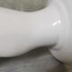 White ceramic hand wall lamp