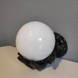 Black ceramic handand white opaline ball sconce