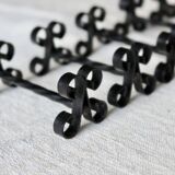 6 vintage black metal knife rests with scrollwork decoration