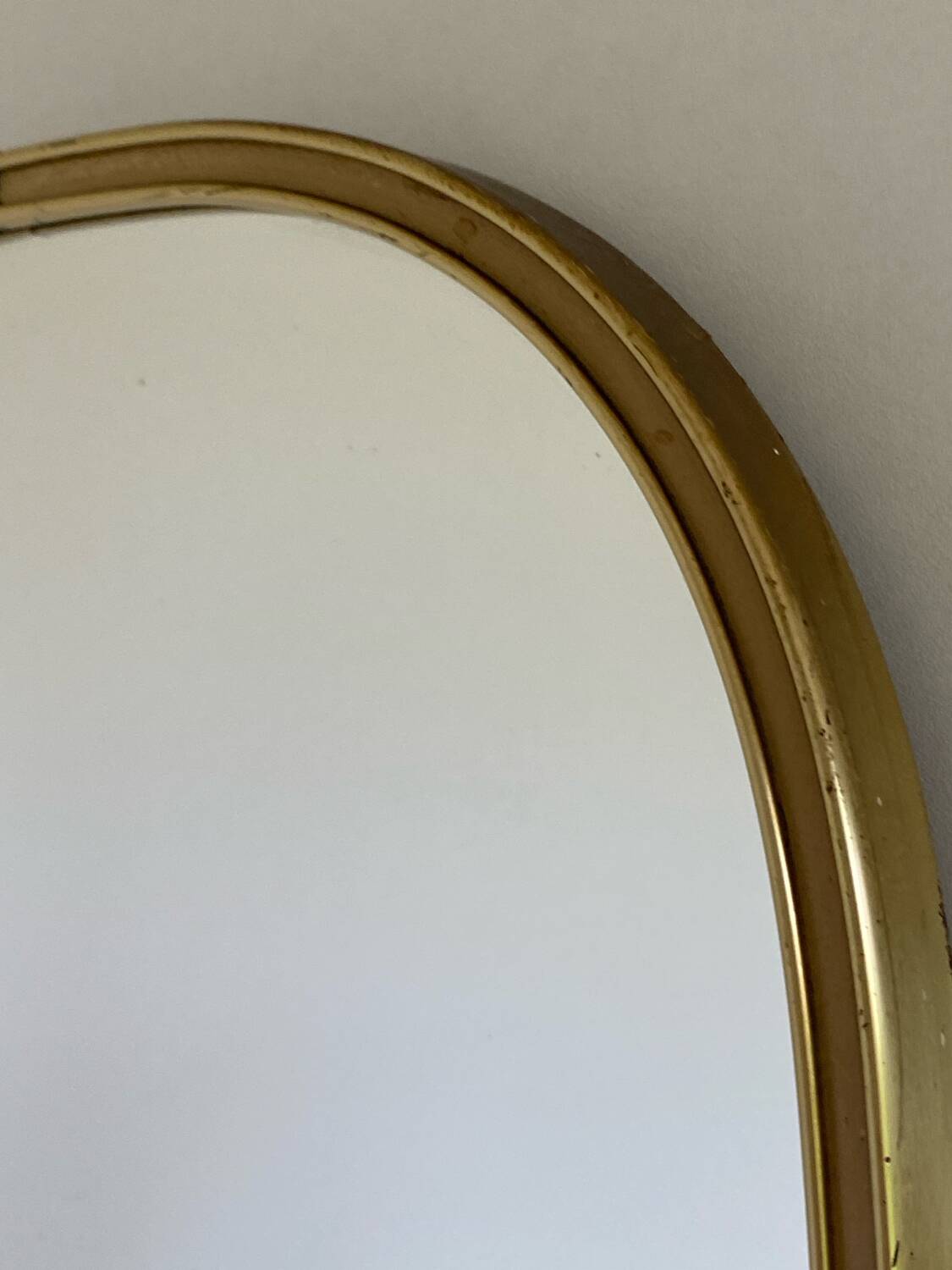 Vintage brass mirror in rear-view mirror shape