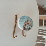 Vintage wall coat hook in brass and Bakelite.