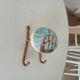 Vintage wall coat hook in brass and Bakelite.