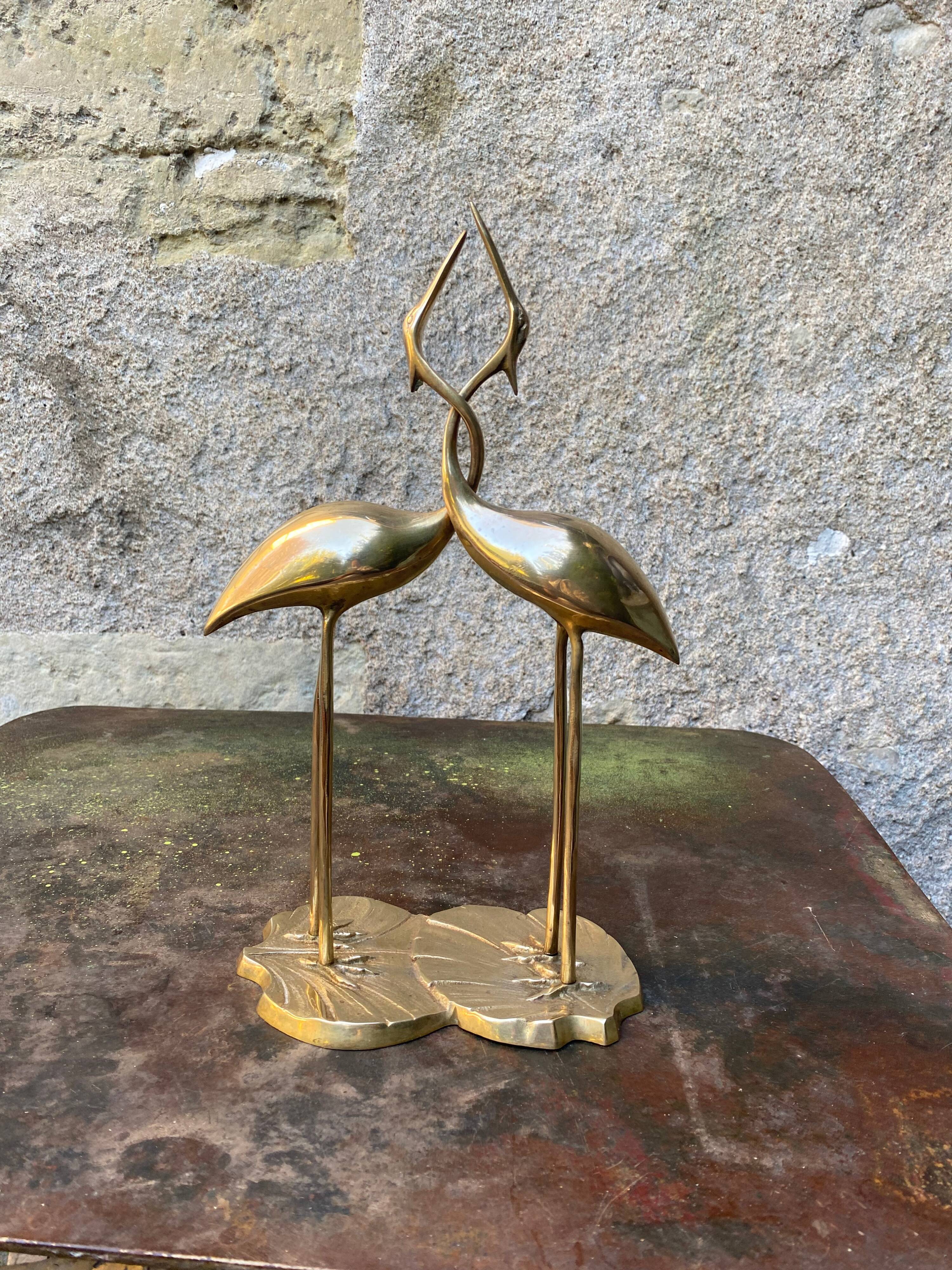 Couple of brass herons