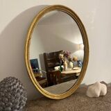 Old golden oval mirror