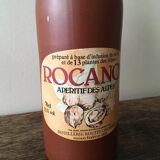 Old bottle in hazelnut Brown sandstone with label