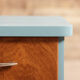 Pair of vintage bedside tables completely redesigned in blueberry on compass feet in solid oak tinted teak