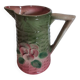 Slush pitcher. Pansy pattern on wicker basket background. Green and pink.