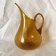 Blown glass jug with caramel bubbles