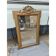 19th-century mirror in gilded wood and stucco.