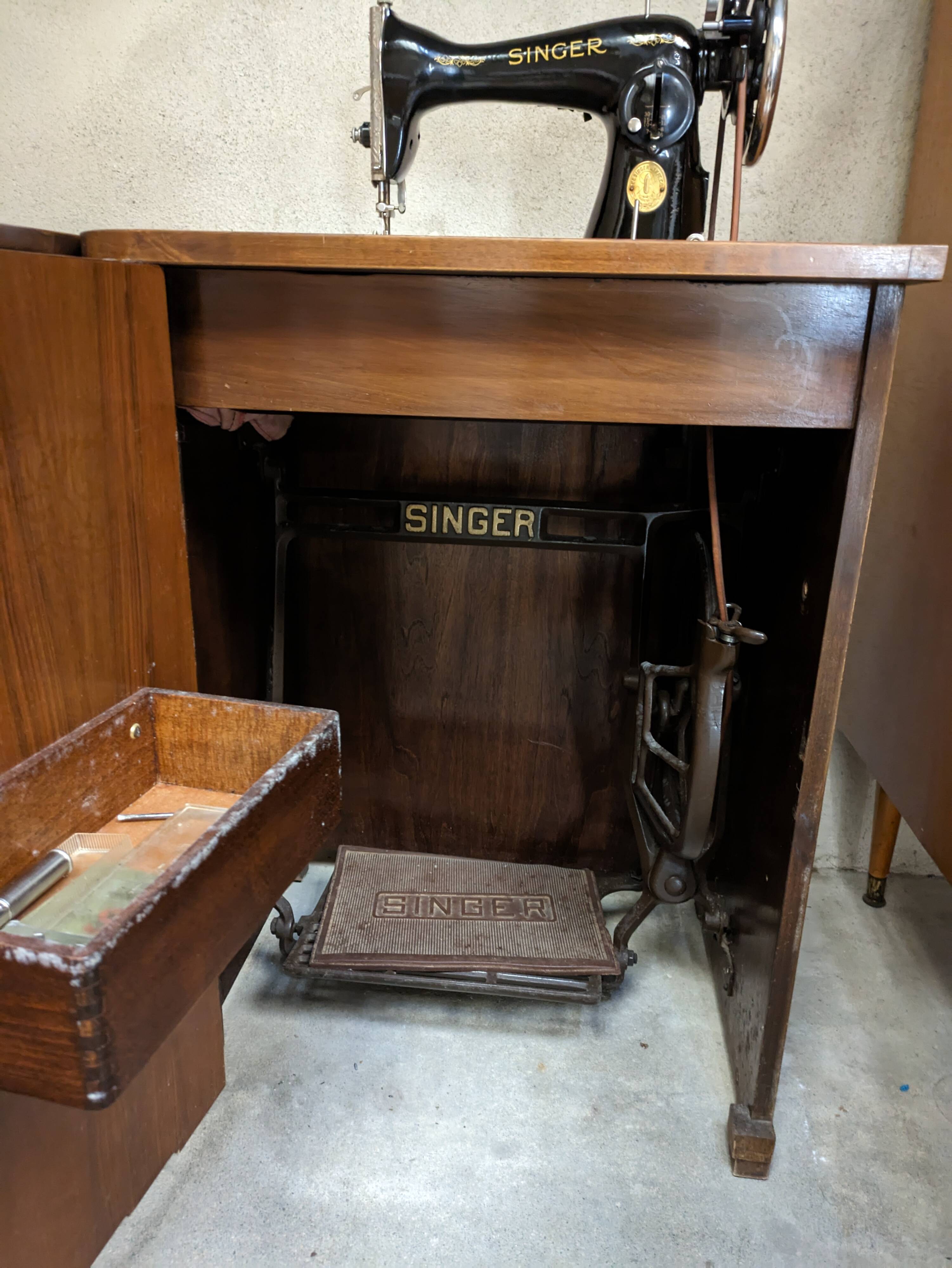 Singer sewing machine in its cabinet