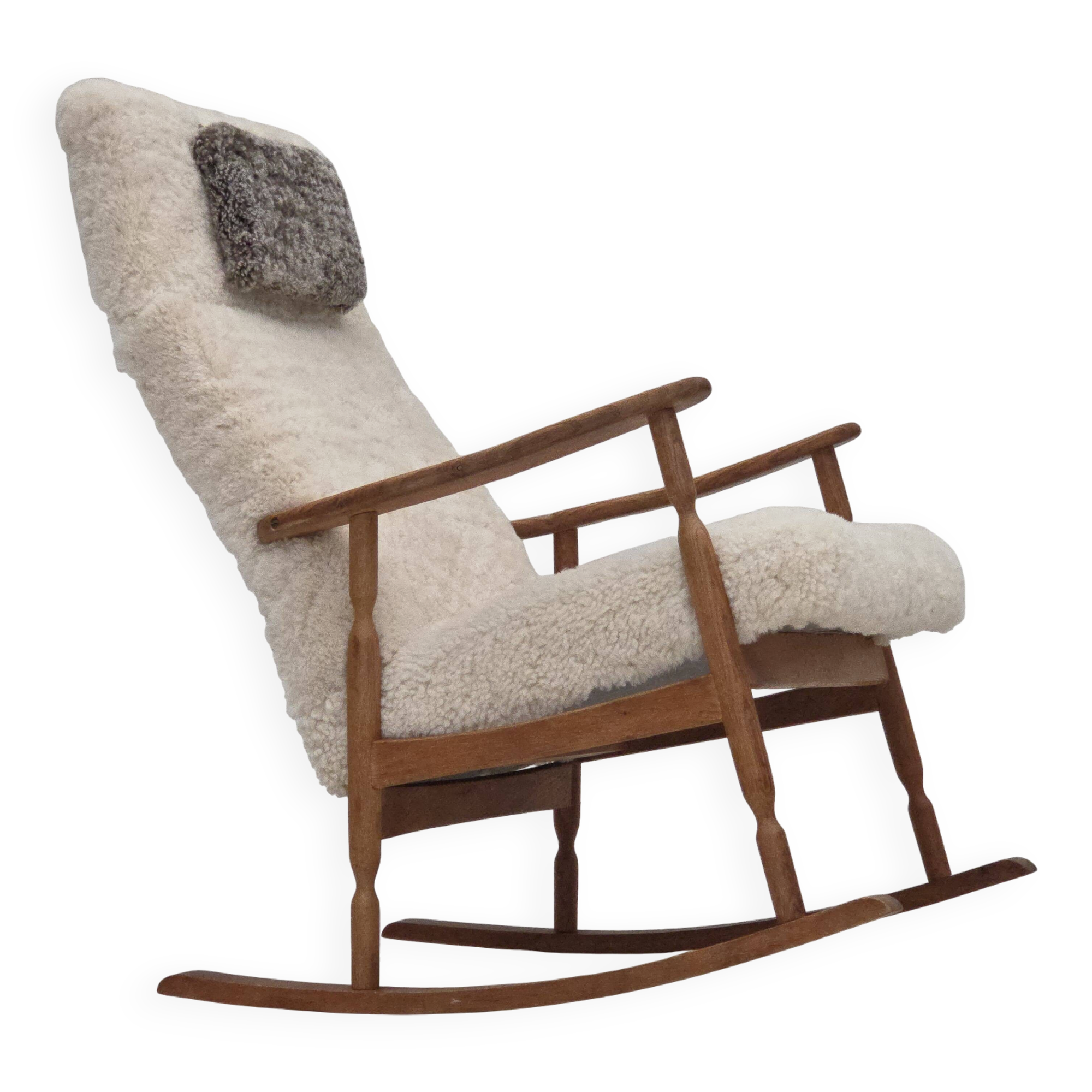 1970s, Danish rocking chair, reupholstered in quality genuine sheepskin.