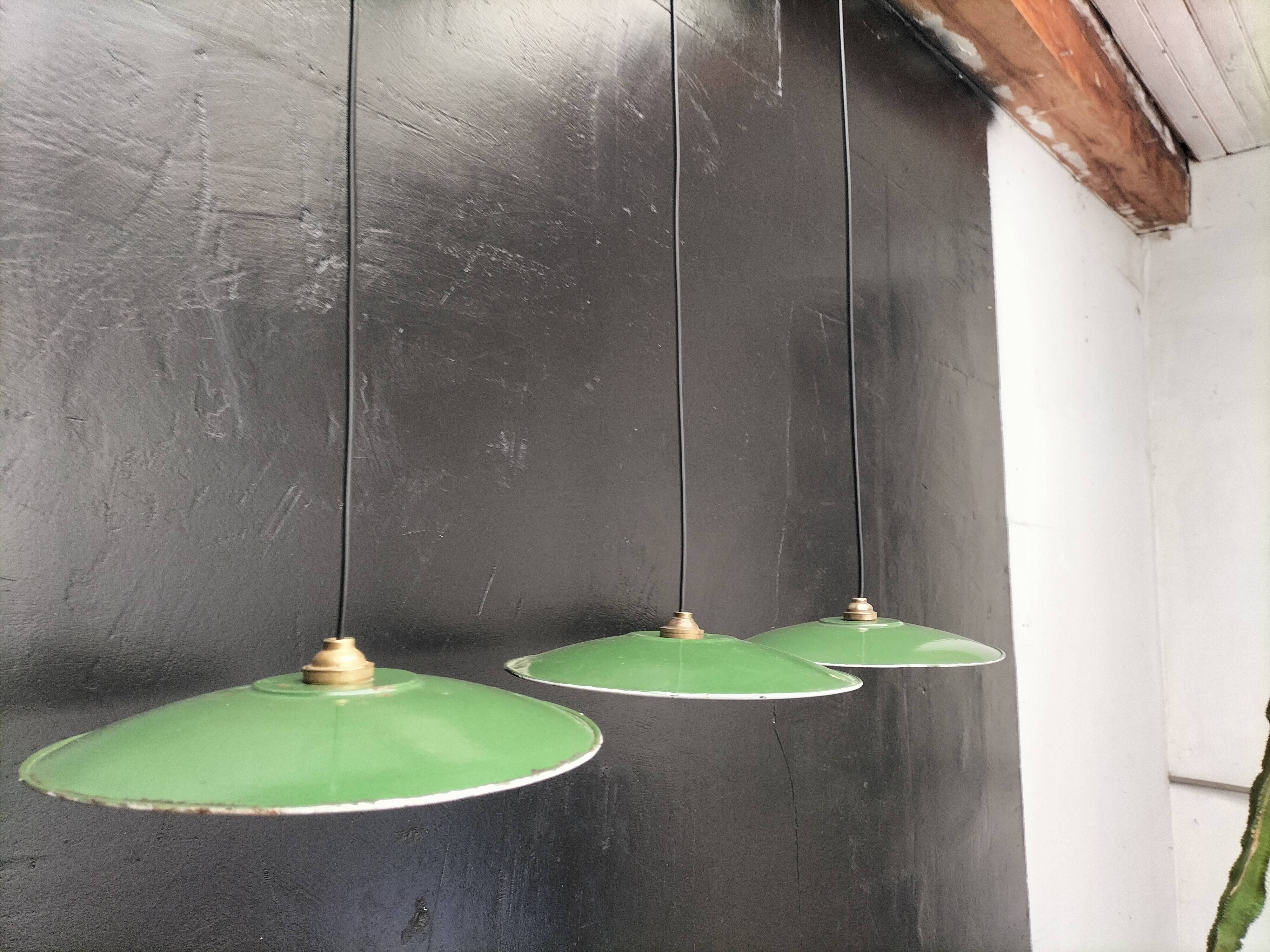 Three enamelled sheet metal suspensions