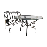 Table in wrought iron and glass, and matching two-seater bench