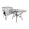 Table in wrought iron and glass, and matching two-seater bench