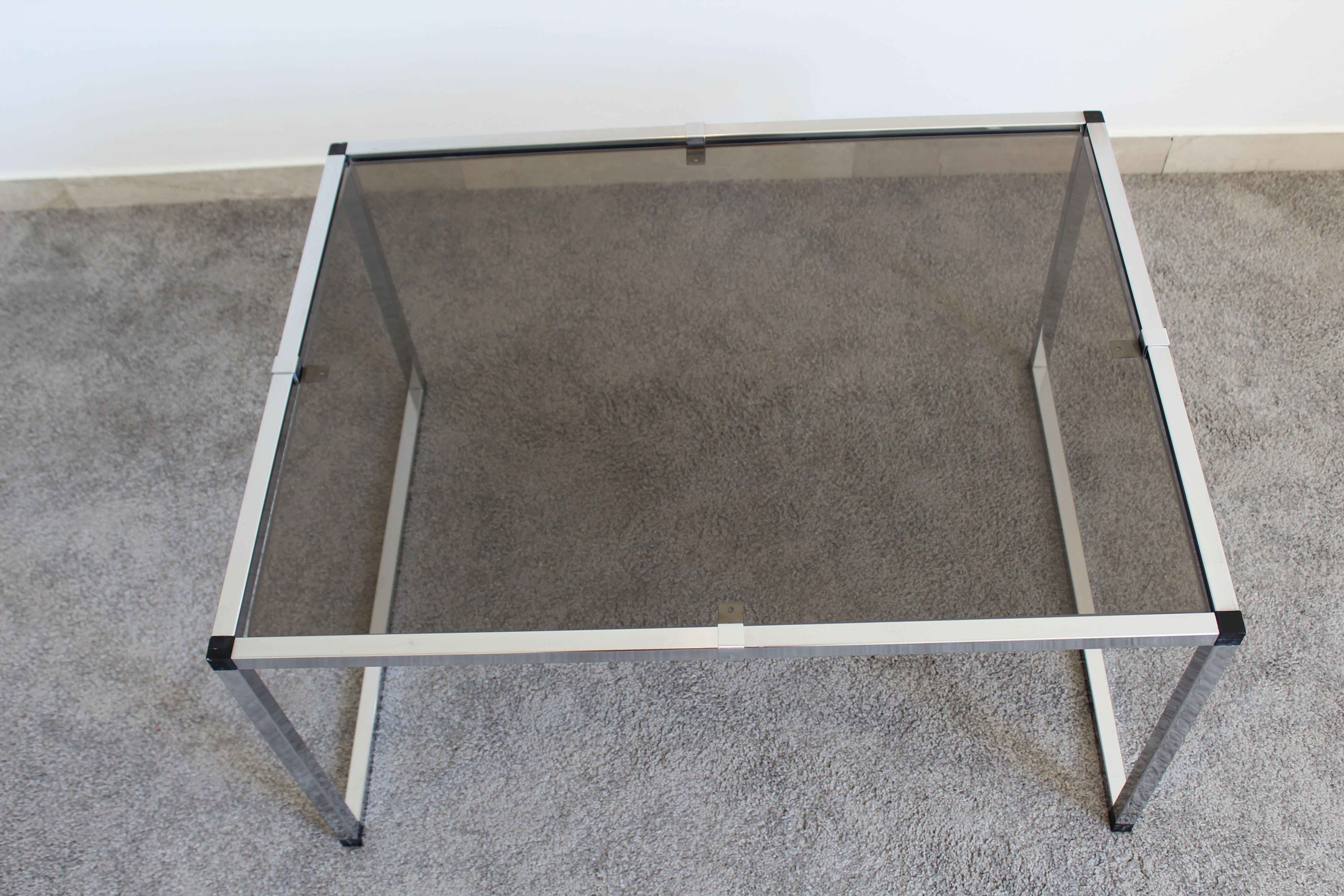 Pair of Coffee Tables in chromed metal and smoked glass, Italy 70's