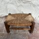 Rustic footrest made of wood and straw