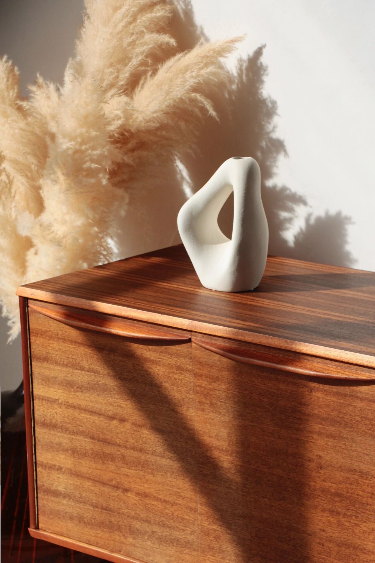 Vintage zebrano and walnut furniture from Morris of Glasgow.