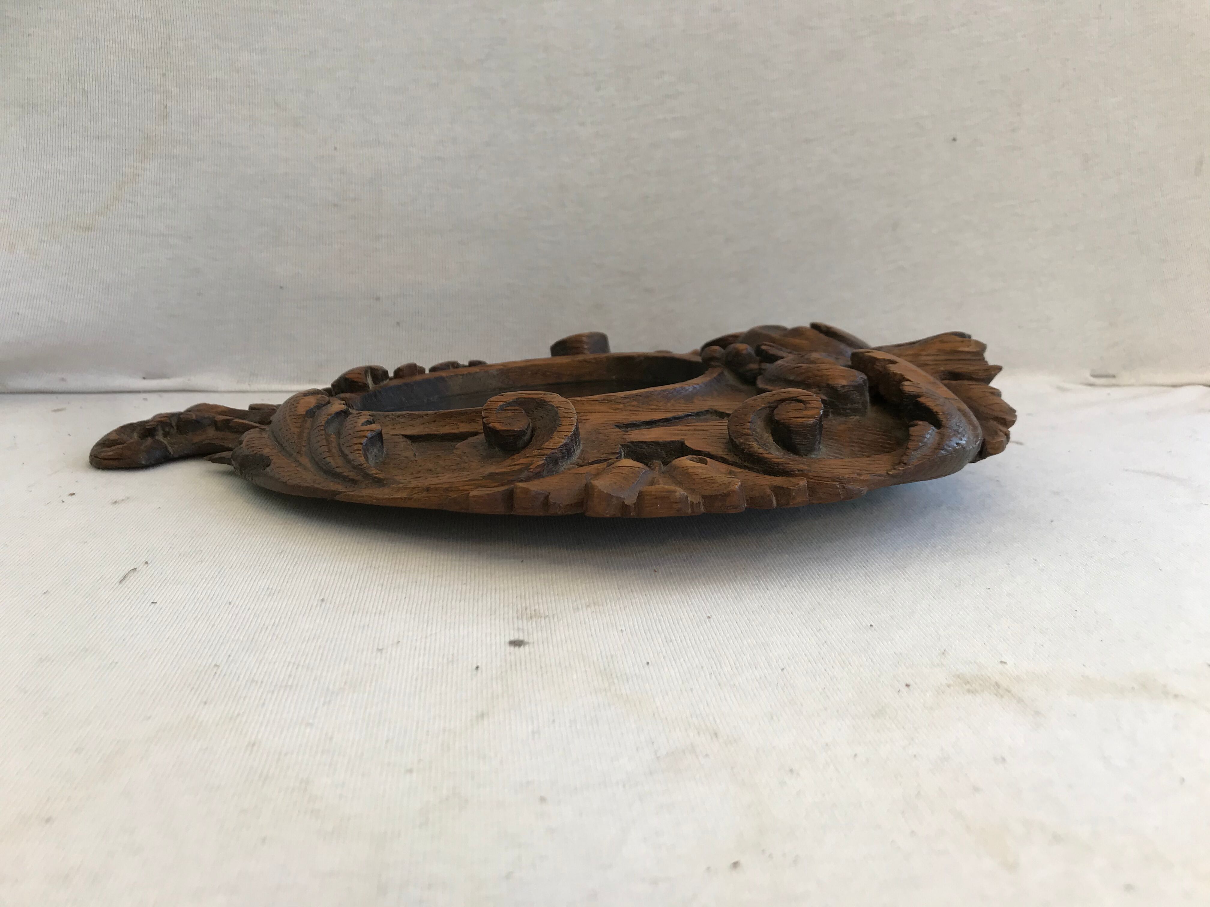 Ancient mirror in carved wood, vintage decoration