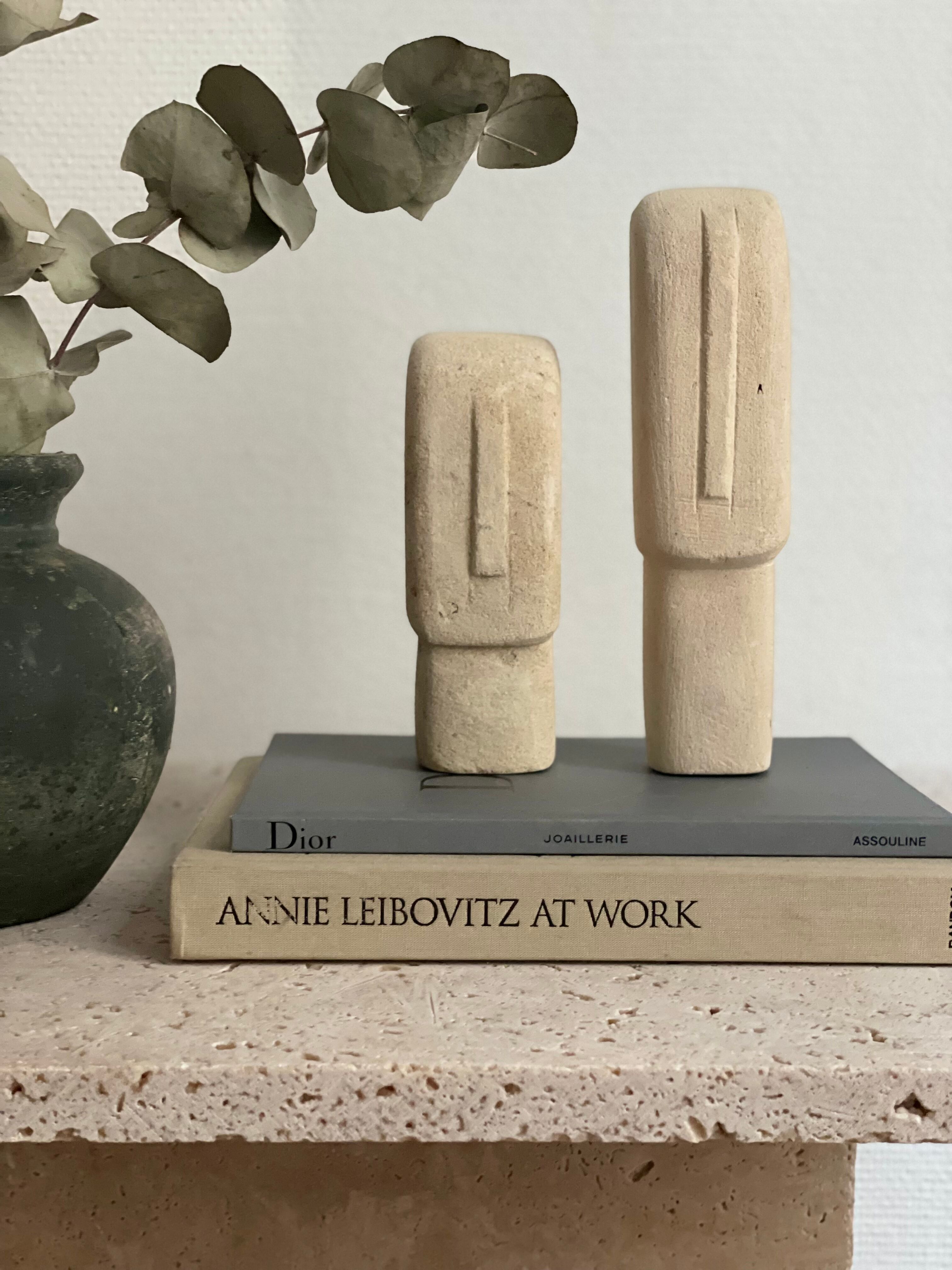 Set of two minimalist stone face statues