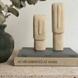 Set of two minimalist stone face statues