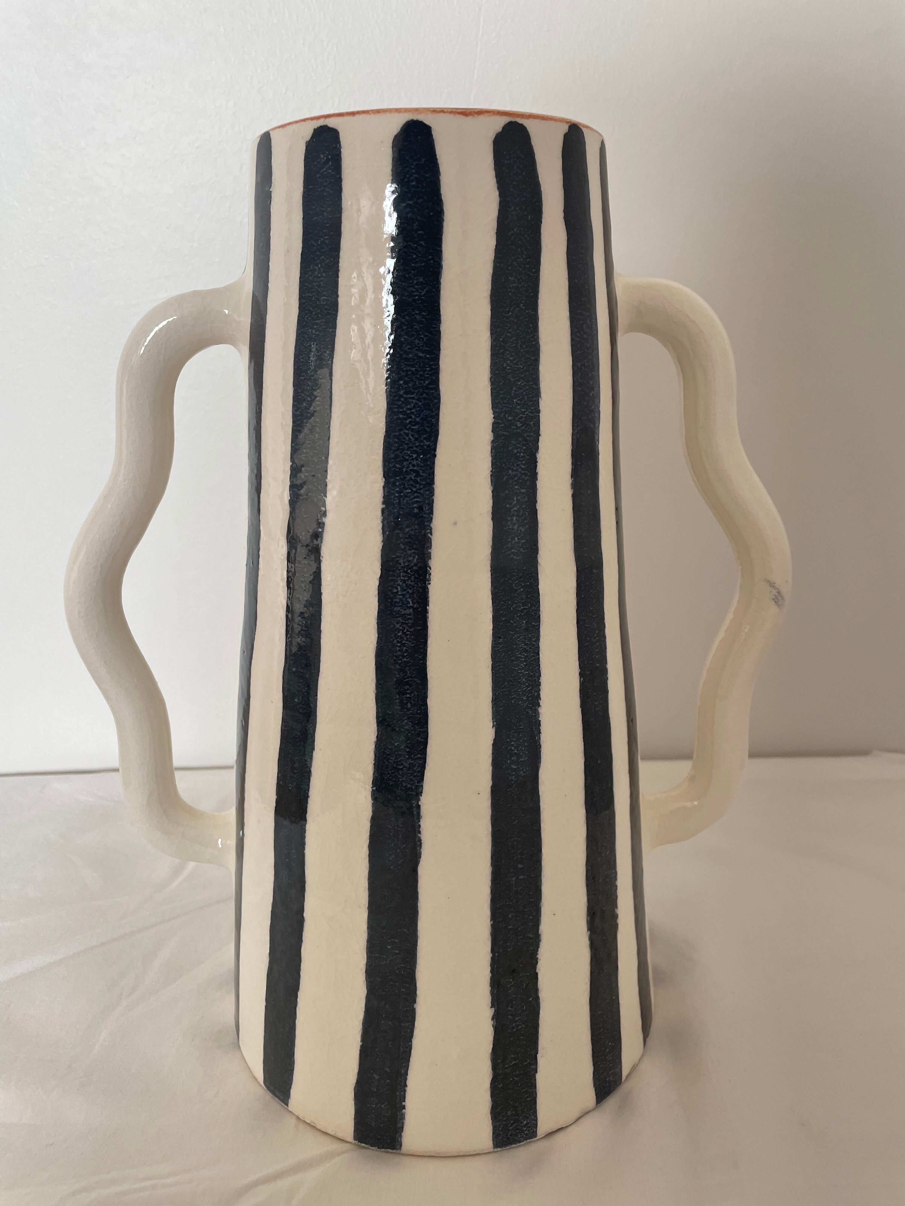 Blue-grey striped ceramic vase with abstract handmade wavy handheld