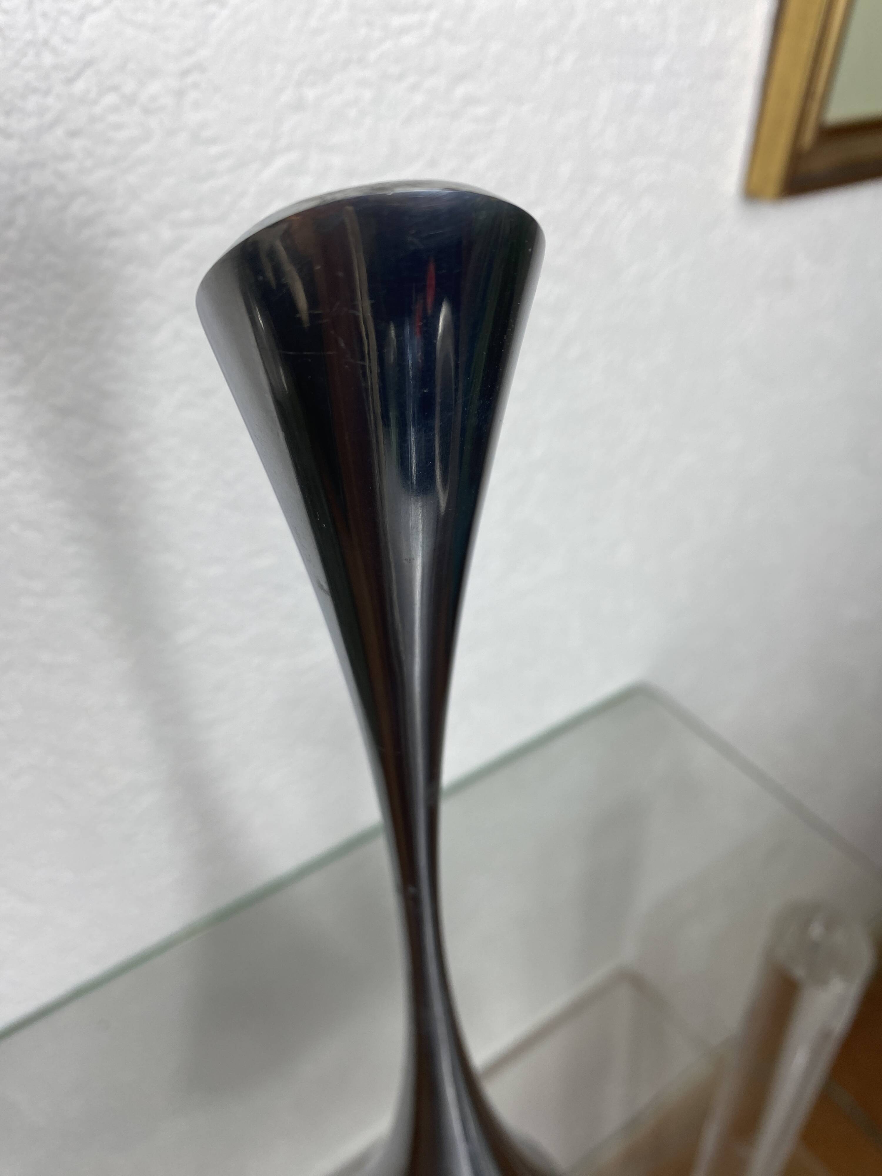Pair of designer candle holders in stainless steel