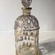Ensemble de trois bouteilles de parfum Guerlain " Abeilles " avec une bouteille de parfum Lalique