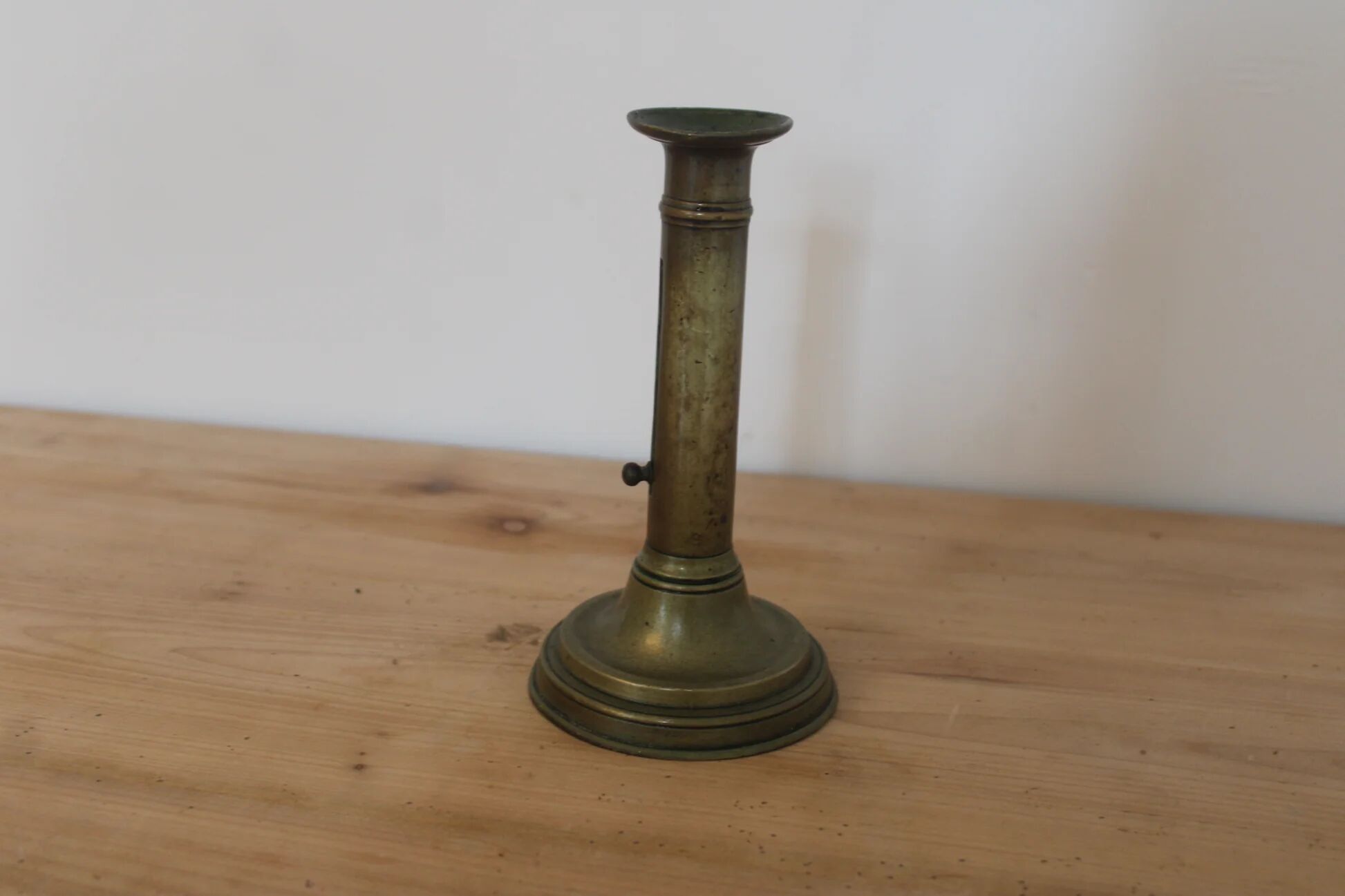 Antique brass push candle holder – vintage patinated candlestick H20 cm