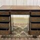 English mahogany pedestal desk with leather top from the 1950s