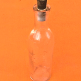 Embossed graduated apothecary bottle 1950's