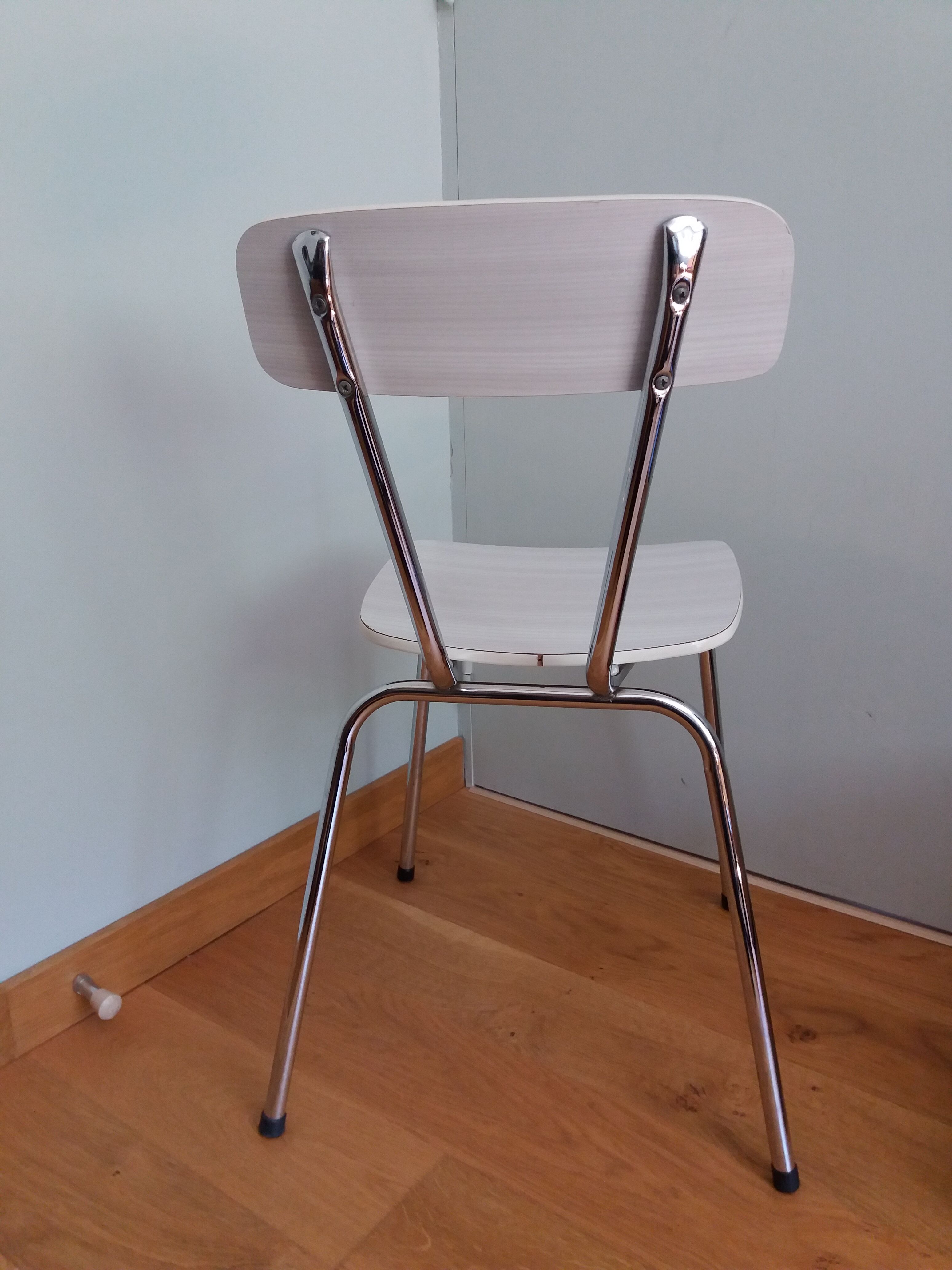 Chrome metal chair and formica white striped gray