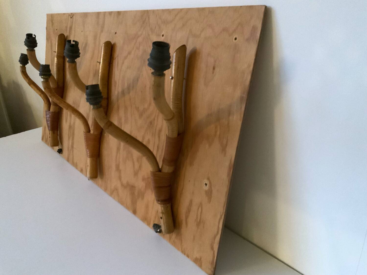 Rattan wall light trio