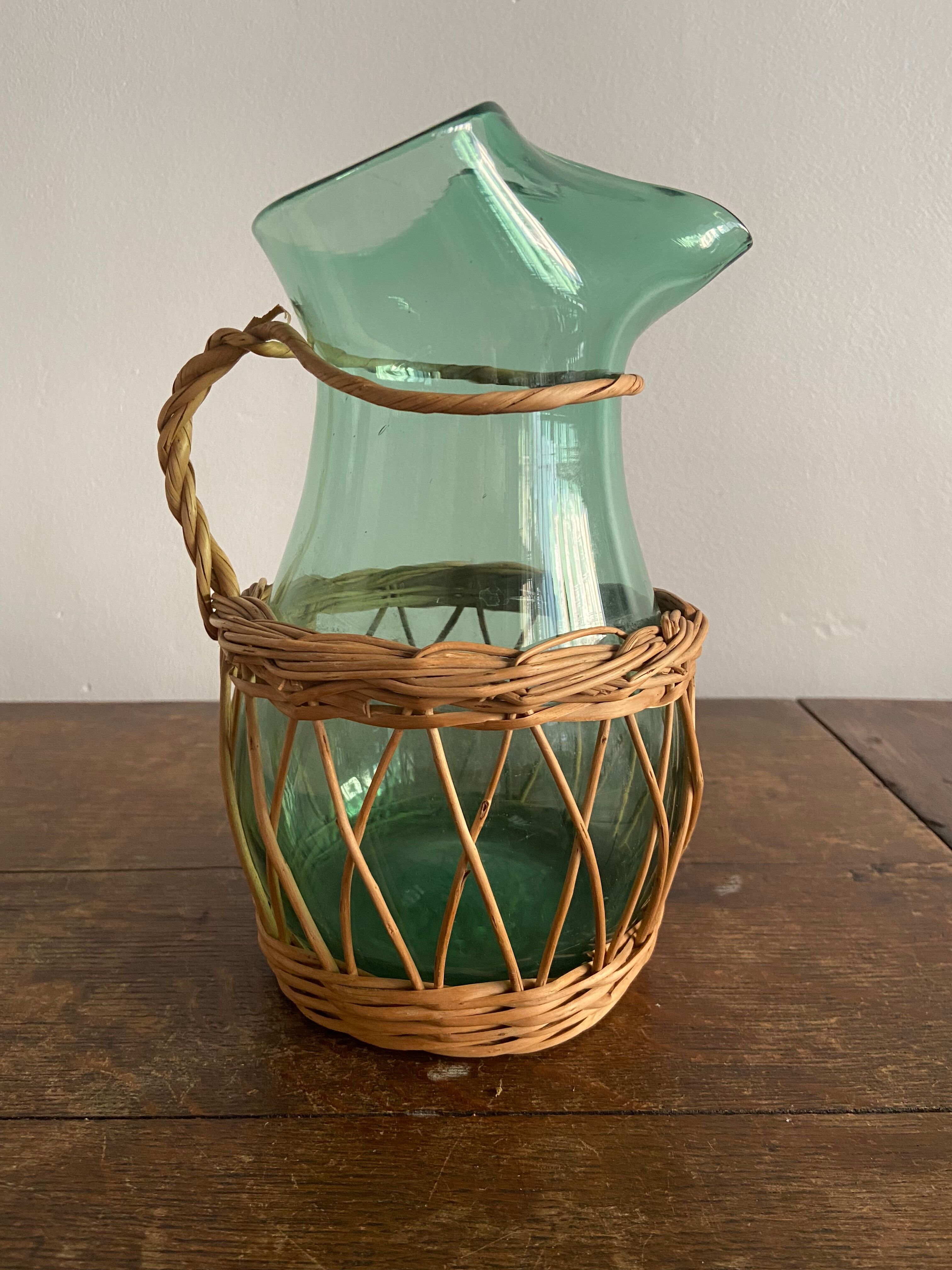 Glass pitcher and wicker