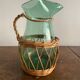 Glass pitcher and wicker
