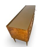 Veneered burl walnut chest of drawers with light warm brown glass top