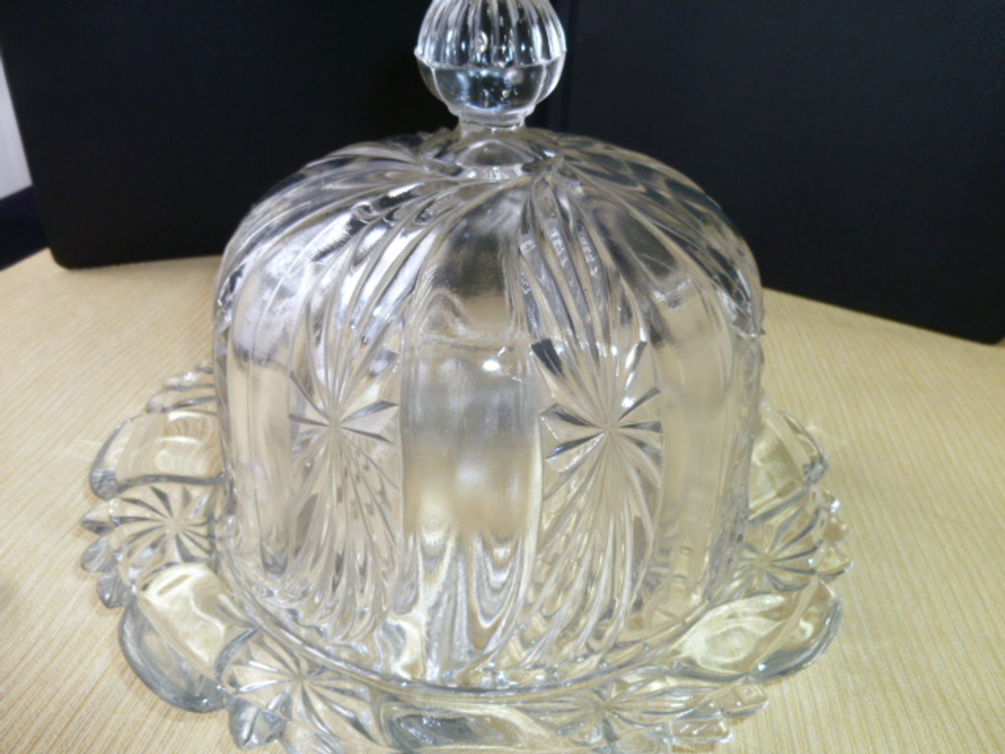 Old cheese bell on its molded pressed glass tray
