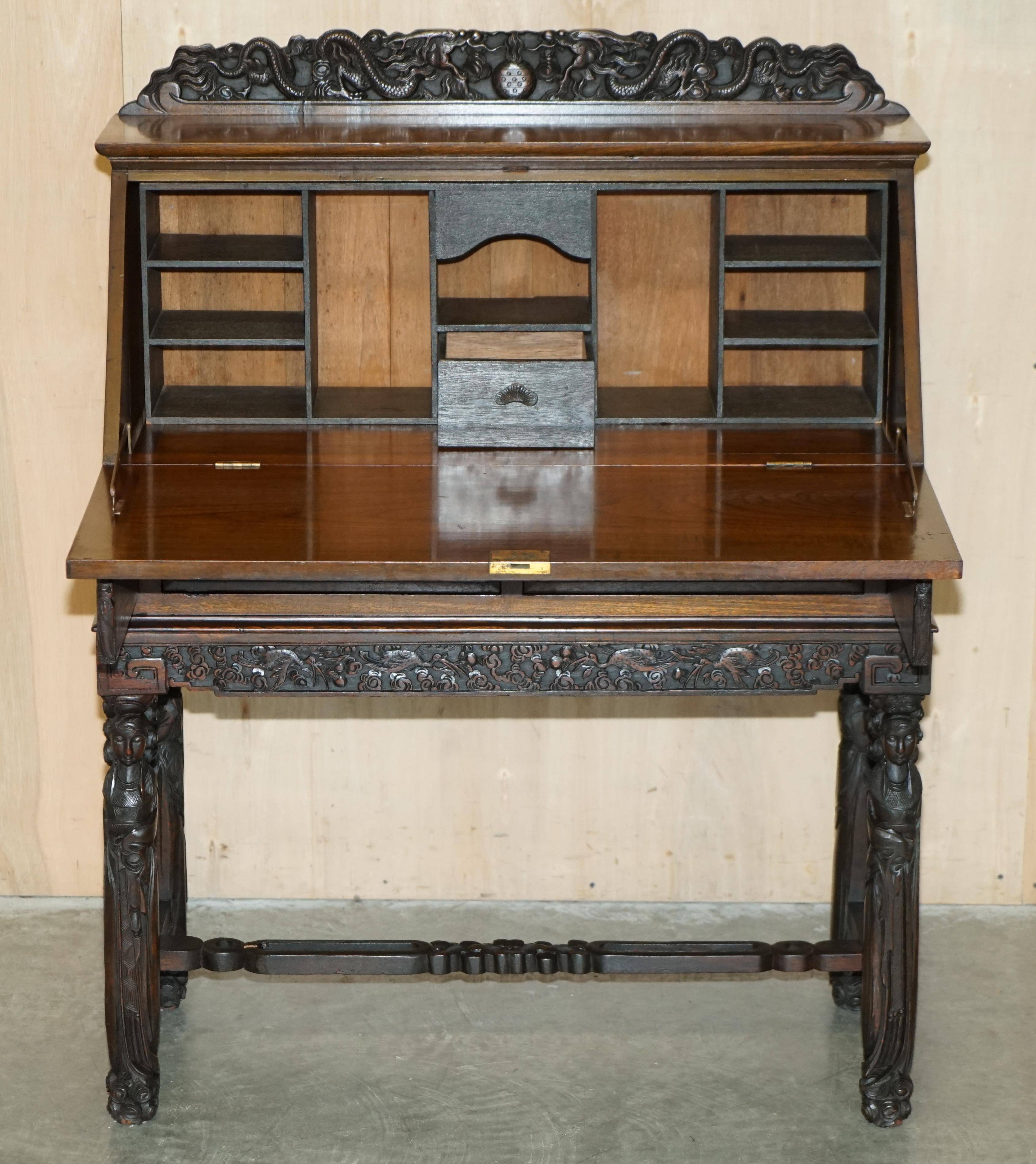 Chinese hand-carved desk from around 1940 with matching chair.