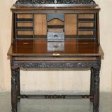 Chinese hand-carved desk from around 1940 with matching chair.
