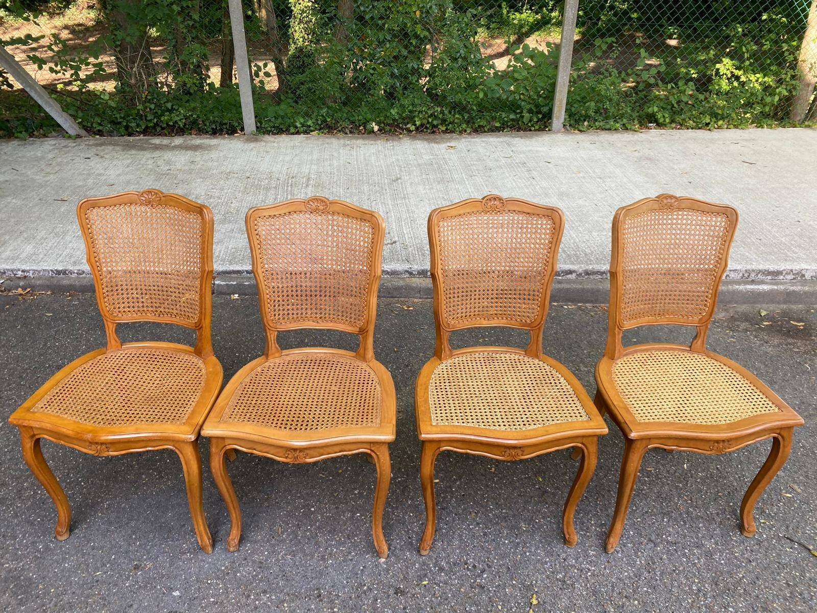 4 Louis XV dining chairs in light solid wood with caning.