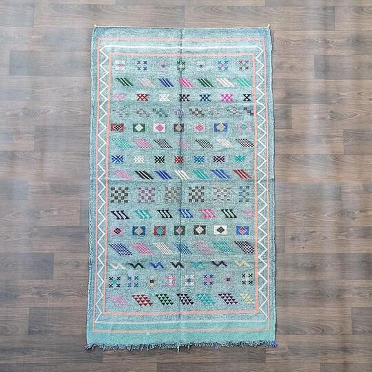 Faded blue Berber ethnic carpet