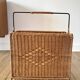 large wicker / rattan and black iron magazine rack from the 70s