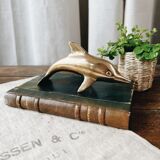 Dolphin in golden brass